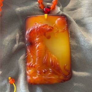 Amber Beeswax Tiger Pendant Necklace.